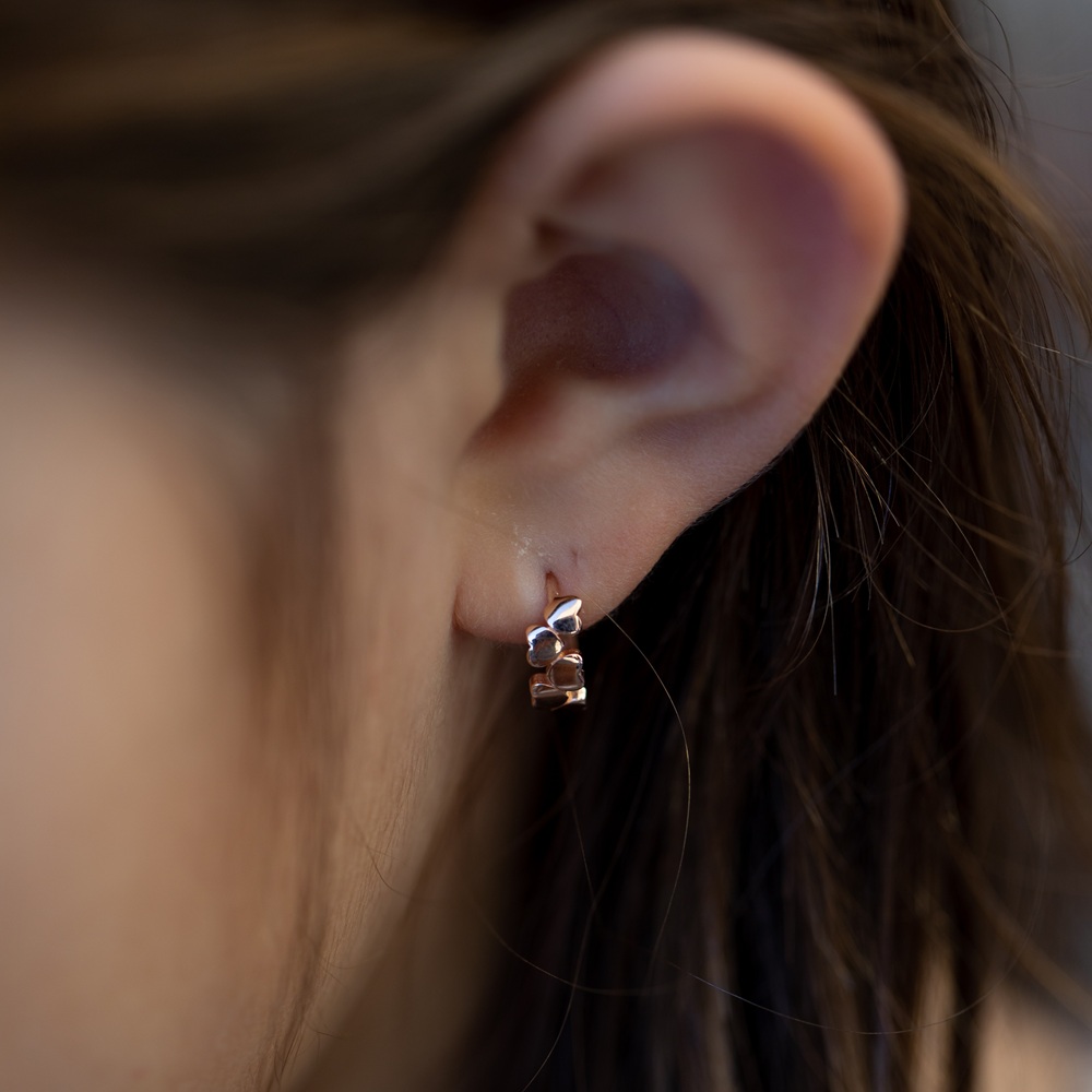 children's earrings on ear of girl
