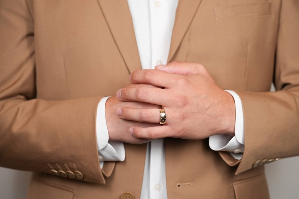 man with yellow gold wedding band