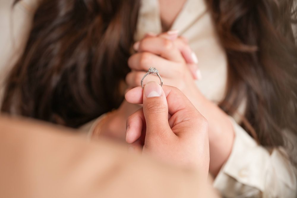 guy proposing with engagement ring